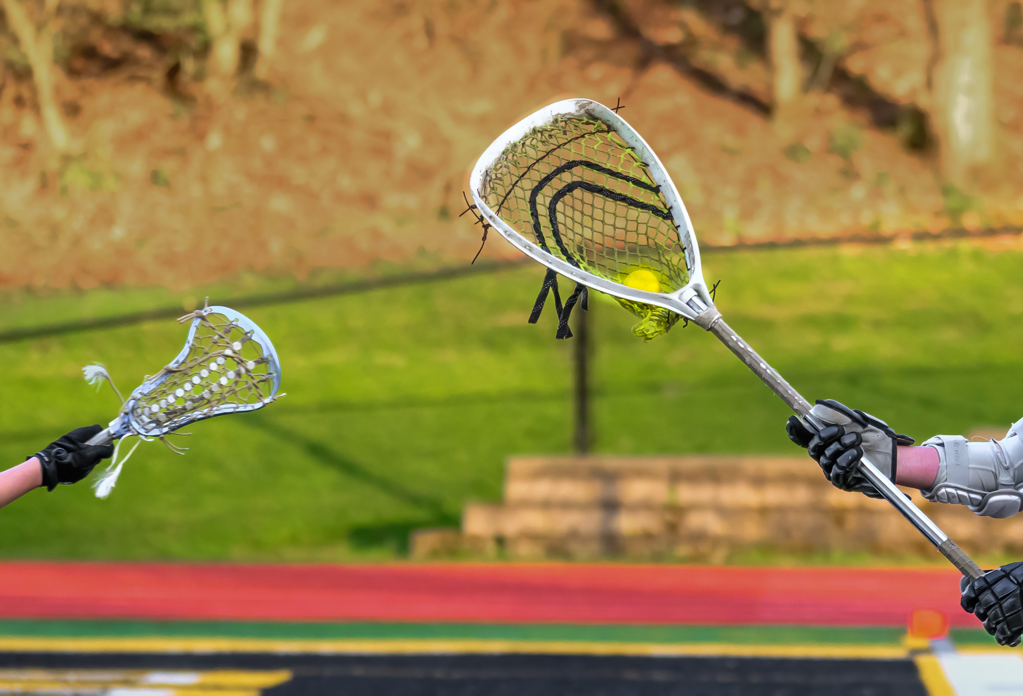 Lacrosse sticks in action on the field
